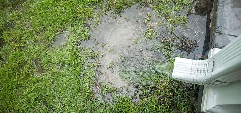 Surface water drainage system in a Farnham home showing gullies and rainwater flow management