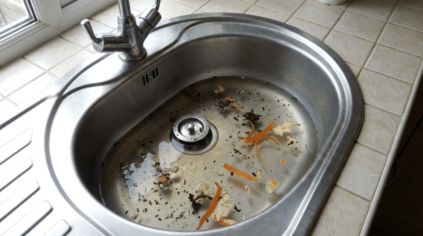 slow draining kitchen sink indicating blocked drains in farnham home